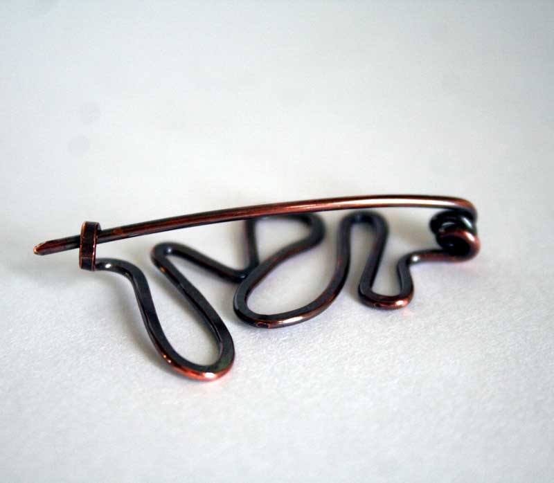 back view of copper pin - Meandering