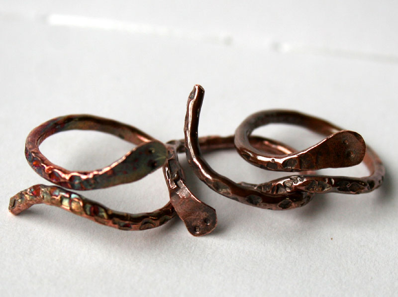 Group of Transformation adjustable copper serpent rings handcrafted by Julie A. Brown